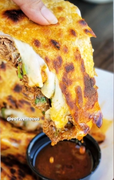 Quesataco dipped in consomé